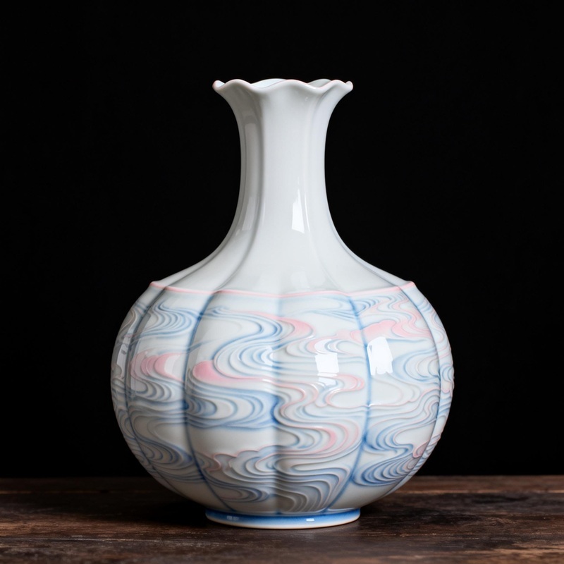 Handcrafted cloud-patterned porcelain vase (new Chinese style) with blue-pink gradient glaze, displayed on wooden surface